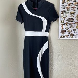 A fitted black and white dress. Good quality. Hardly worn.
